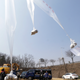 Illustration for article titled Campaigners Float Thousands of Anti-Jong-Un Flyers into North Korea